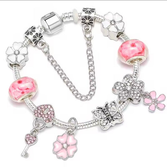 Kids baby pink+ charm bracelet sprinkled with charms