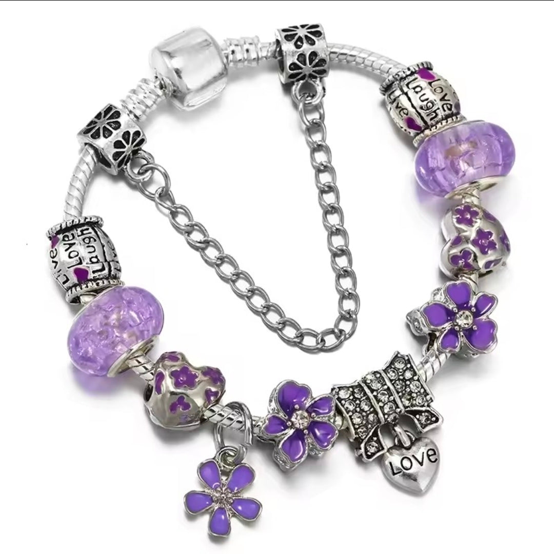 Kids Ludere Purple+ charm bracelet sprinkled with charms